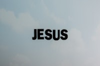 the word jesus is written on the side of a car